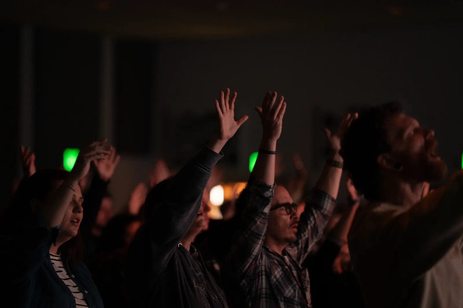 Hands raised in worship at Sun City Church